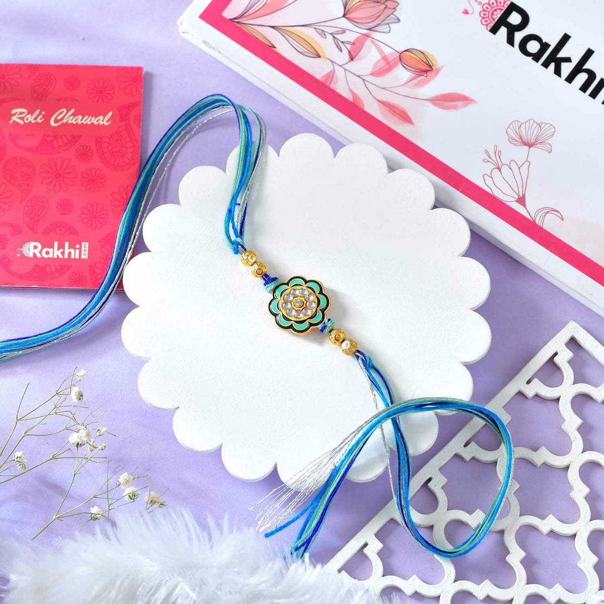 Floral Shaped Bhai Rakhi With Blue Thread