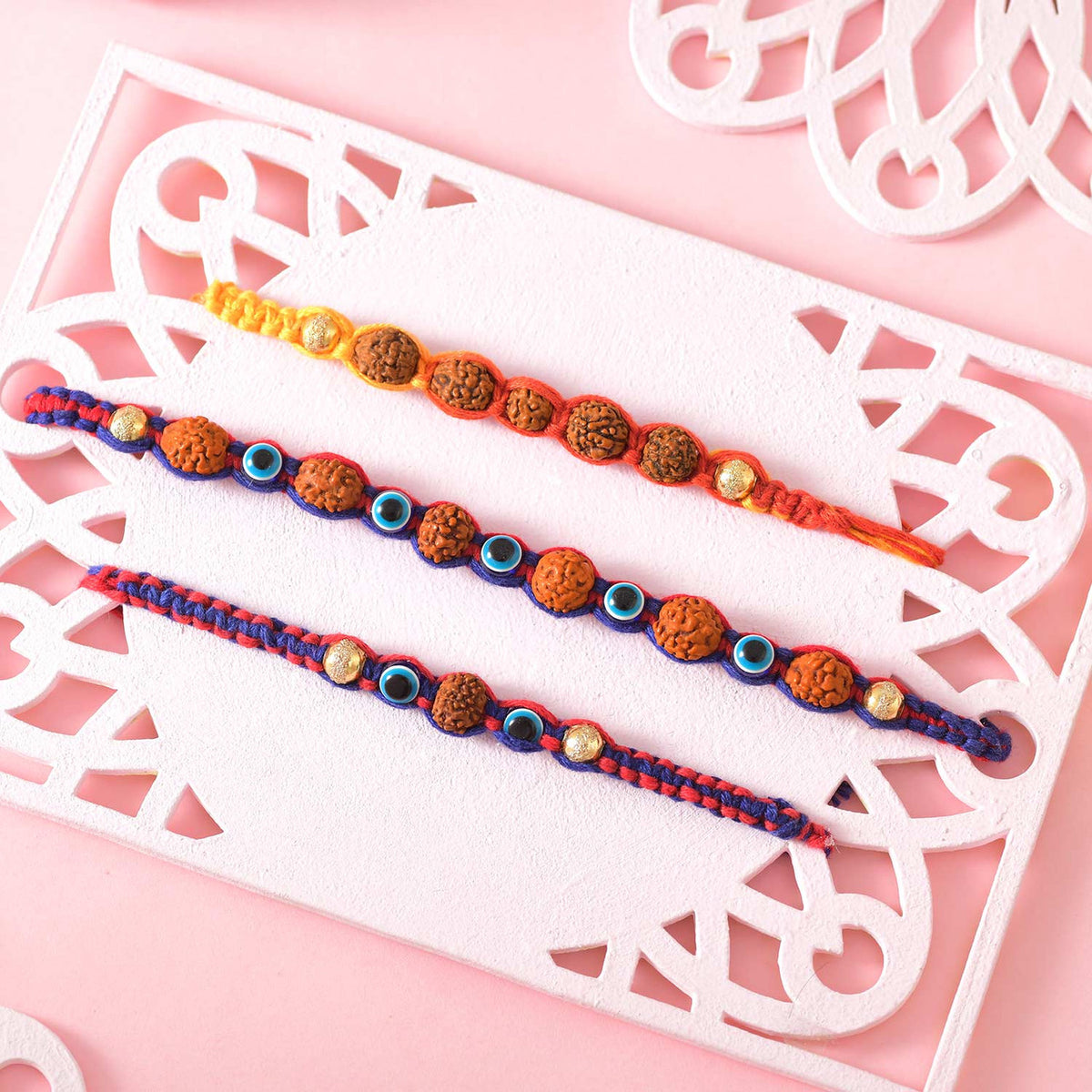 Rudraksha and Evil Eye Beads Rakhi With Kaju Katli Sweet