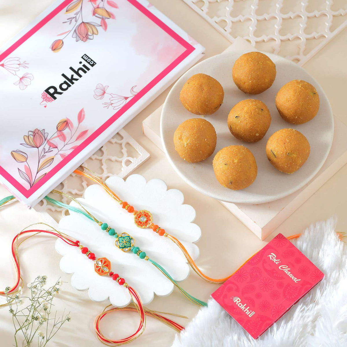 Set of 3 Floral Shape Rakhi With Besan Laddoo