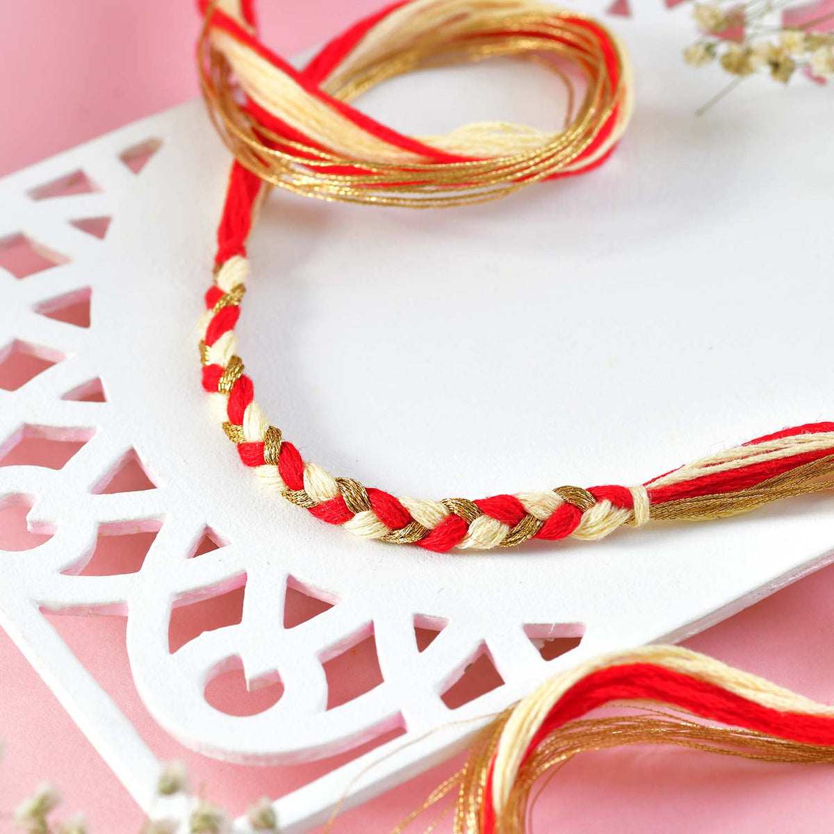 Elegant Rakhi Set with Ganesha Charm