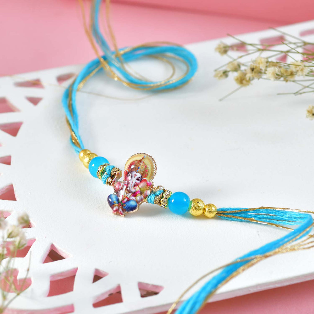 Elegant Rakhi Set with Ganesha Charm