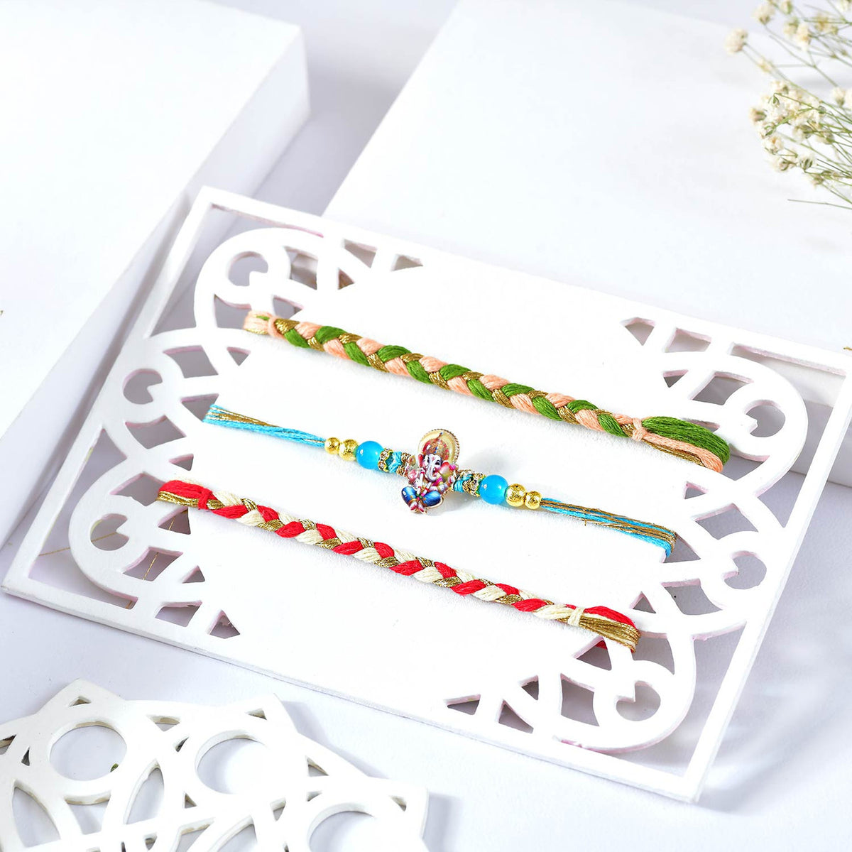 Elegant Rakhi Set with Ganesha Charm