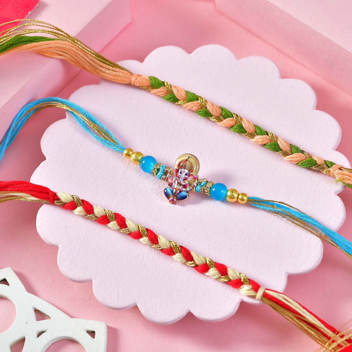 Elegant Rakhi Set with Ganesha Charm