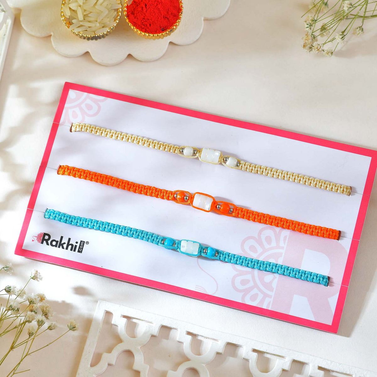 Elegant Rakhi Trio Set