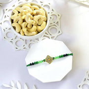 Elegant Beaded Rakhi with Green Thread With Cashew