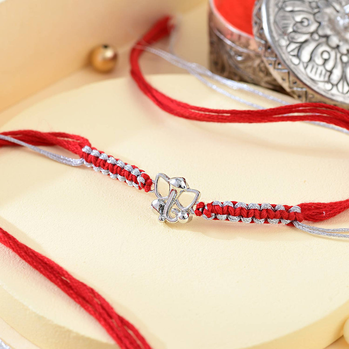 Shree Ganesha Pure Silver Rakhi Sweet and Chocolate Combo