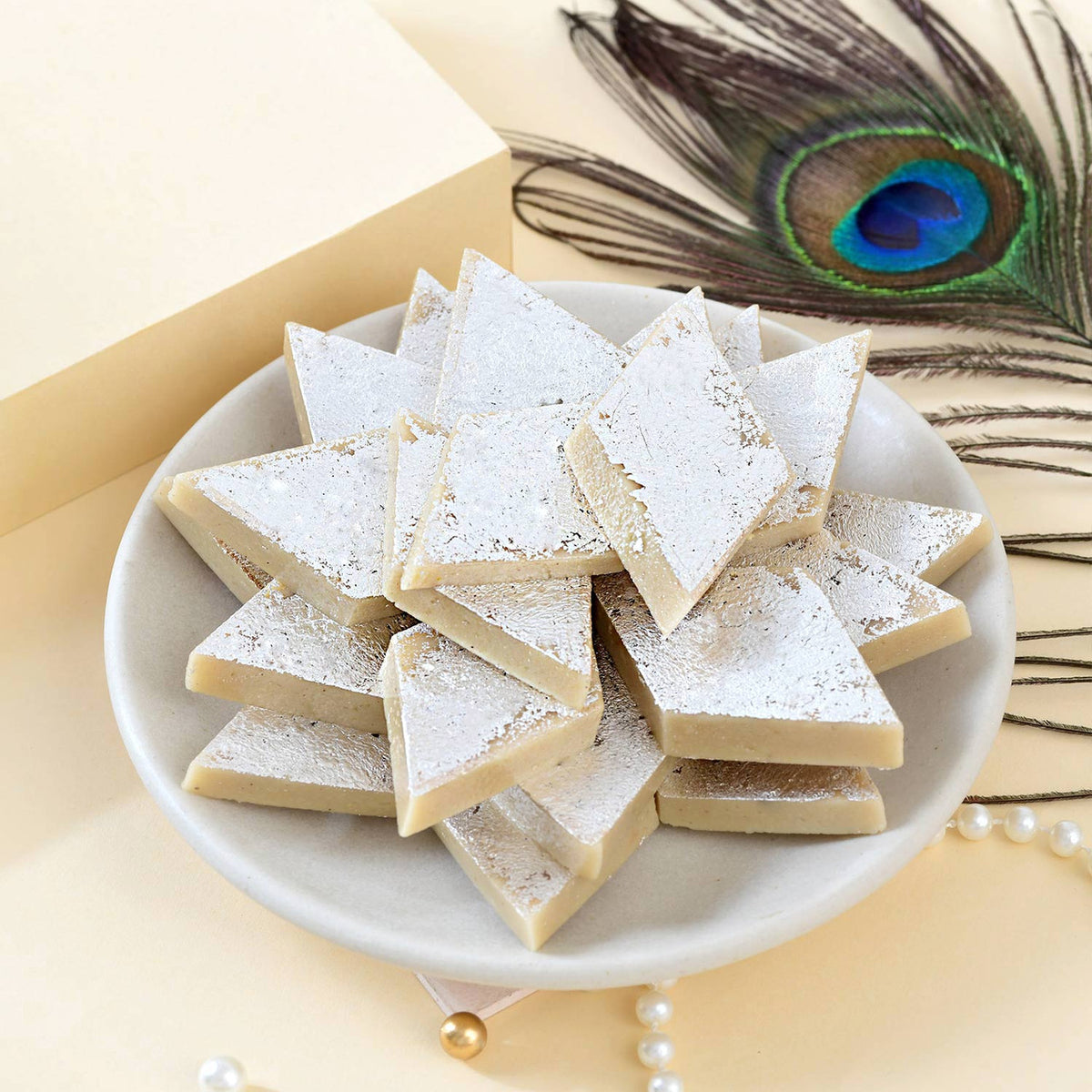 Pure Silver Om Rakhi with Kaju Katli & Lindt Chocolates