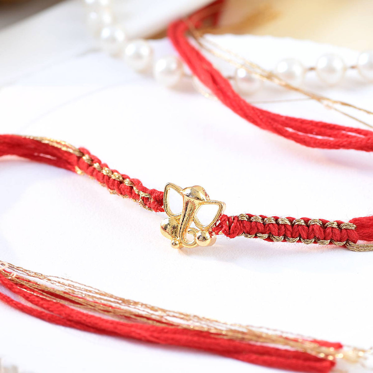 Gold Plated Shubh Ganesh Rakhi with Kaju Katli & Ferrero Rocher Combo