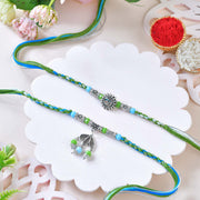Blue-Green Designer Rakhi Set with Om & Peacock Charm