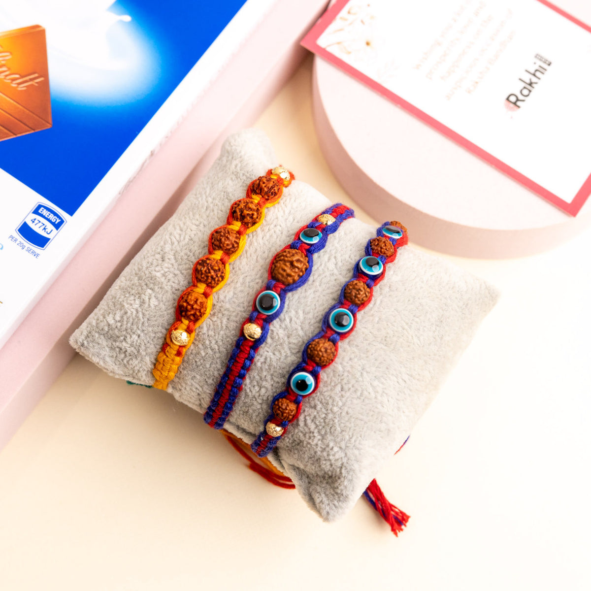 Rudraksha and Evil Eye Beads Rakhi with Lindt Milk Chocolate