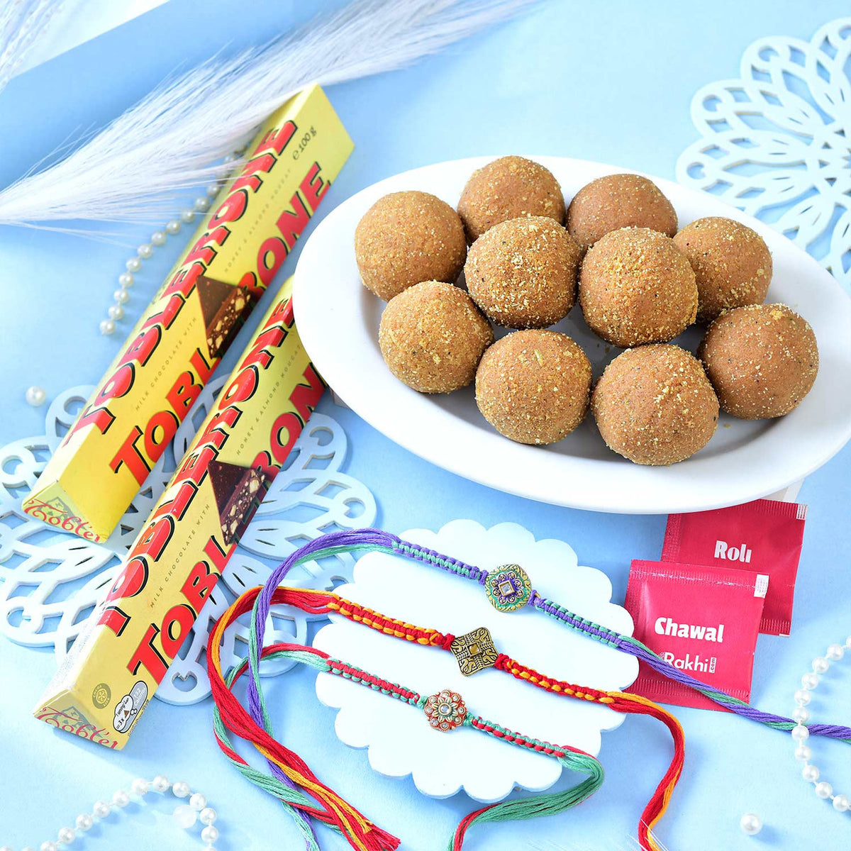 Designer Rakhi Set with Besan Laddoo & Toblerone Chocolates